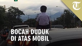 Viral Foto Anak Duduk di Atas Mobil yang Sedang Melaju