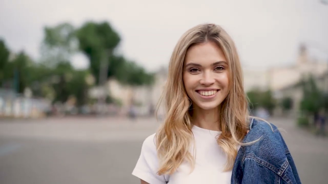 Portrait Of A Happy Young Woman Walking Towards The Camera