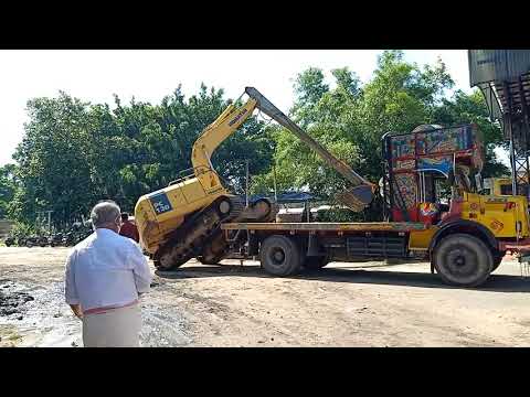 komatsu long stick  excavator  transporting