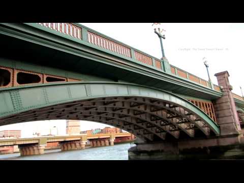 Walk along the Thames Path to Southwark Bridge in London