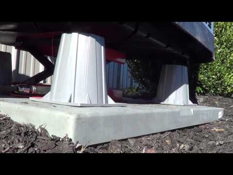 Part of a video titled Raise a condenser unit for pump up feet without hurting your back