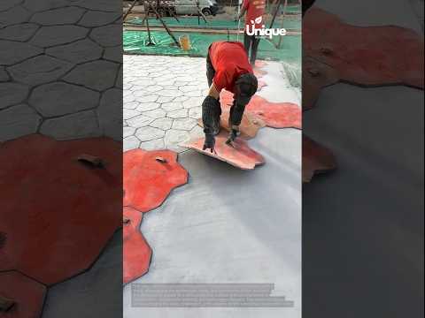Stamping concrete: people stamping concrete with a mold