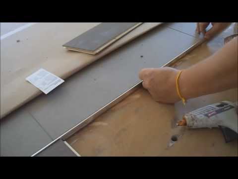 How to install metal transition strip between hardwood floor...