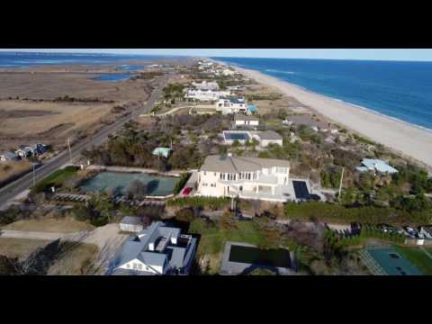Low flight over lavish oceanfront estates and cottages along Dune Road, Quogue, NY