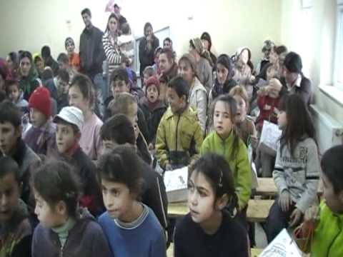 Children singing "E Craciun" (It's Christmas) in Sabolciu, Romania.