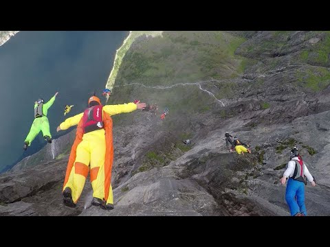 Base Jumpers Leap From Waterfall