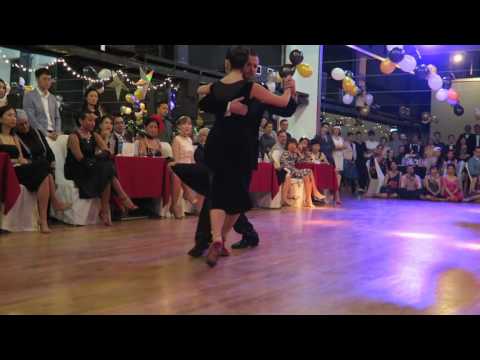  Neri Piliu  and  Yanina Quiñones  are  dancing  to  "  Que Falta Que Me Haces  "  by  Miguel Caló  at  Singapore International Tango Festival  in  2016