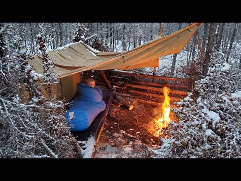 Winter Camping in Snowstorm Building Survival Shelter and Bushcraft Cot