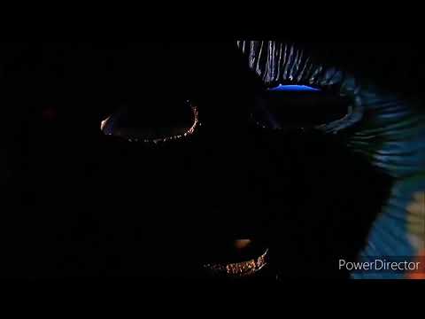 Son Of The Mask (2005)-Tim trys on loki's Mask.