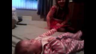 baby laughs like a maniac at girl letting off whoopee cushion