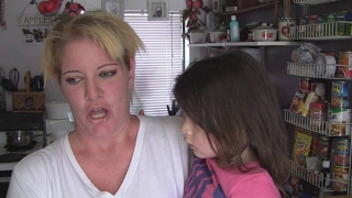 Tracy and her four children are one of the thousands of families who call a motel "home".