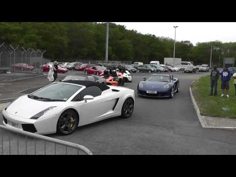 Murcielago SV enters the paddock with a Porsche Carrera GT