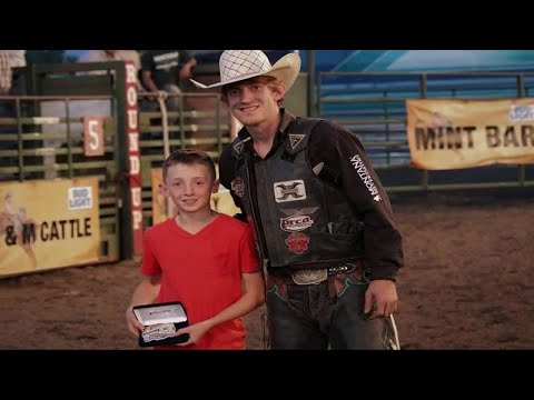 Parker Breding riding at NFR with Chinook cancer-survivor in heart