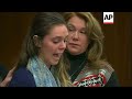 Sisters testify before father lunges at Nassar