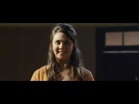 The Sapphires official trailer still — a soul group in sequins stepping onto a Vietnam USO stage, spotlights blooming