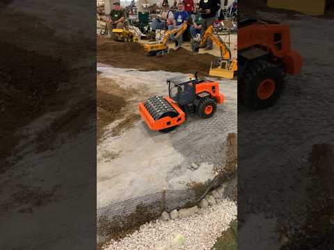 RC construction roller packing down the stone road