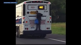 Man hitches a ride on the back bumper of a bus in Boulder in wild video; RTD is investigating
