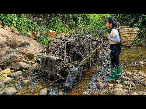 Restoring a tractor that had been abandoned for many years by the stream.