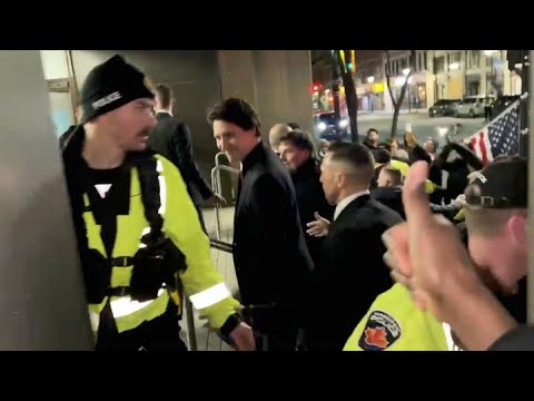 NERVES OF STEEL Trudeau at ease while confronted by angry protestors in Hamilton