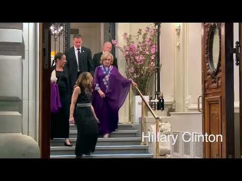 Hillary Clinton dance with a priest in the street