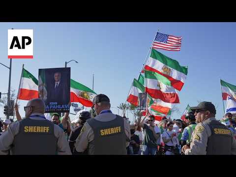 Iranian Americans protest outside stadium at Iran's FIFA World Cup match