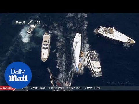 Dramatic moment yacht almost hits boat carrying spectators - Daily Mail