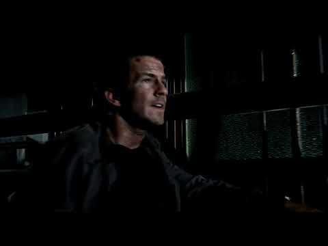 Darkness Falls trailer frame of flashlight beams cutting through a dark hallway