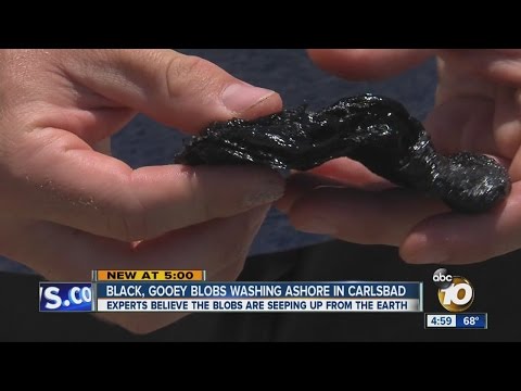 Black, gooey blobs washing ashore in Carlsbad