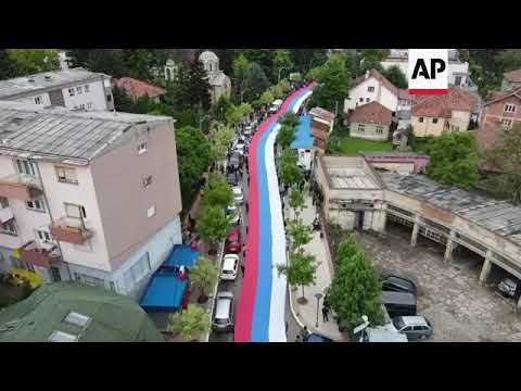 Aerial of Serbian flag at Kosovo protest