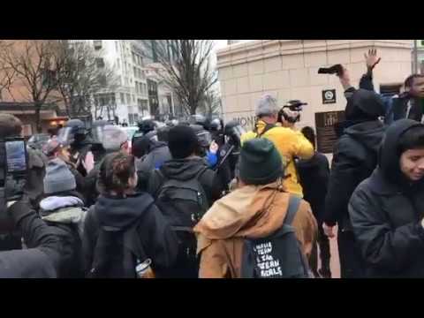 Police arresting protesters in downtown Portland for blocking traffic and lightrail