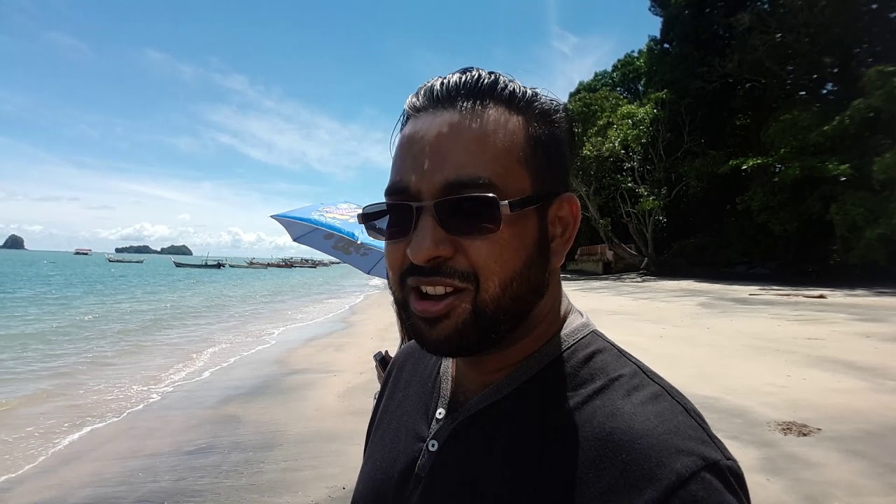 Explore Pantai Pasir Hitam with its striking black sands, gentle waves, and peaceful scenery