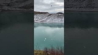 Rock makes strange sound on frozen lake #shorts