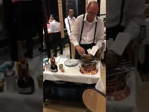 Flaming Cognac at a French restaurant in Dijon France Le Central