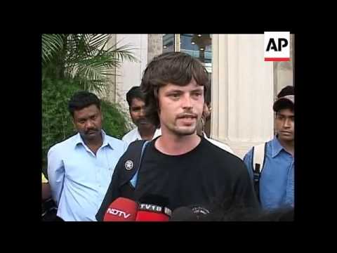 A security guard for Brad Pitt and Angelina Jolie gets rough with a photographer trying to take the