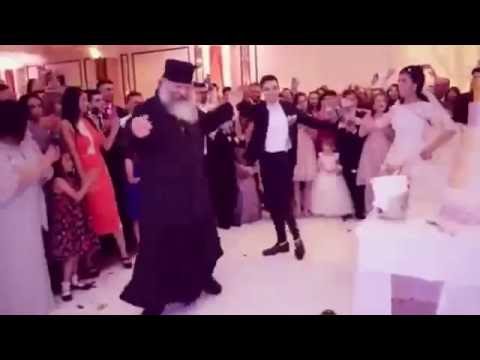 Orthodox Priest rejoices and dances at the wedding (real)