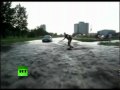Crazy Russian surfing across giant puddle