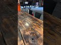 1458335 Bar table built from large door with 8 barstools }}