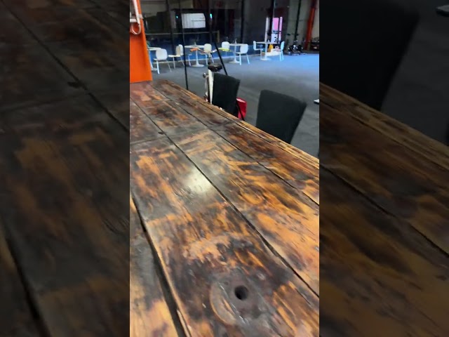 1458335 Bar table built from large door with 8 barstools