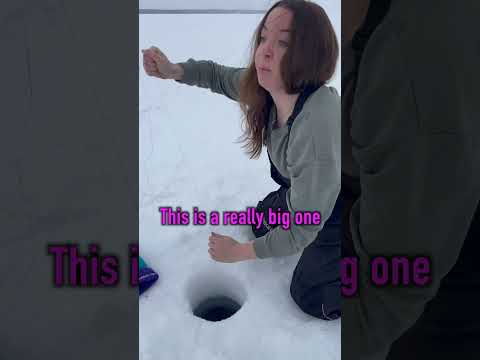 She pulls up a GIANT PIKE while ice fishing