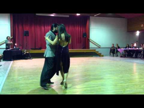  Diego Amado  and  Isabella Fusi  are  dancing  to  a  vals
