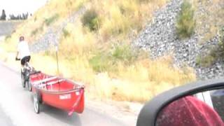 preview picture of video 'Bicycle towing canoe up a hill'