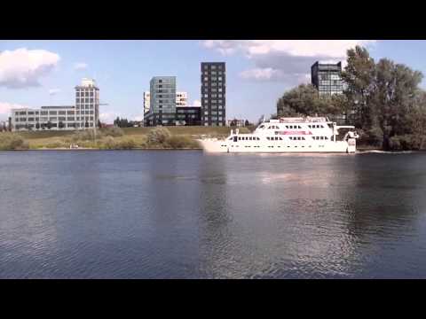 Passenger Boat meets Freight Ship at Venlo/Blerick NL , on river Meuse