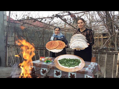 A young lady prepared fasali\ kutab\ of our ancient sweets from our national cuisine for her family
