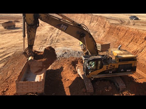 Caterpillar 365C Excavator Loading Trucks With Three Passes