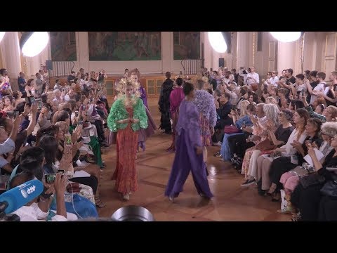 Models and designer on the runway for the Maurizio Galante Fashion Show in Paris