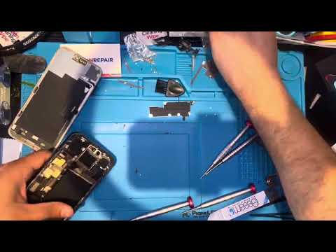Fix 'N Repair technician repairing a device