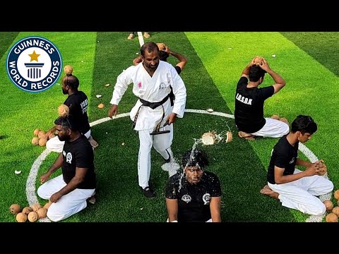 Smashing Coconuts Off Their Heads! - Guinness World Records