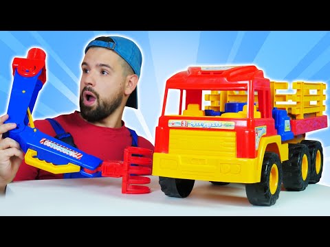 Il camion della legna si è rotto. L'autofficina dei giocattoli con il meccanico per bambini