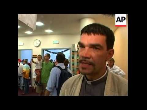 Gay activists struggle to hold conference as parade banned