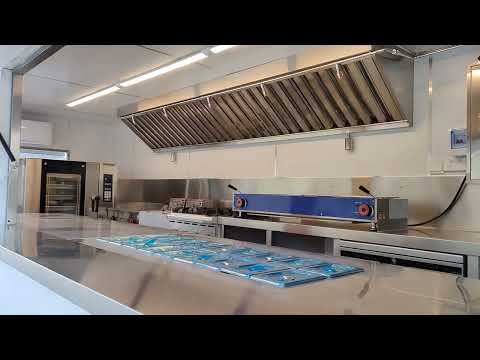 Shipping container restaurant with kitchen equipment